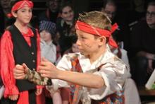  dressed as pirates acting in a play